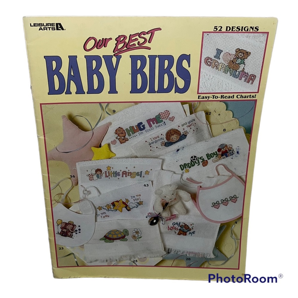 Leisure Arts Our Best Baby Bibs cross-stitch booklet with 52 designs
